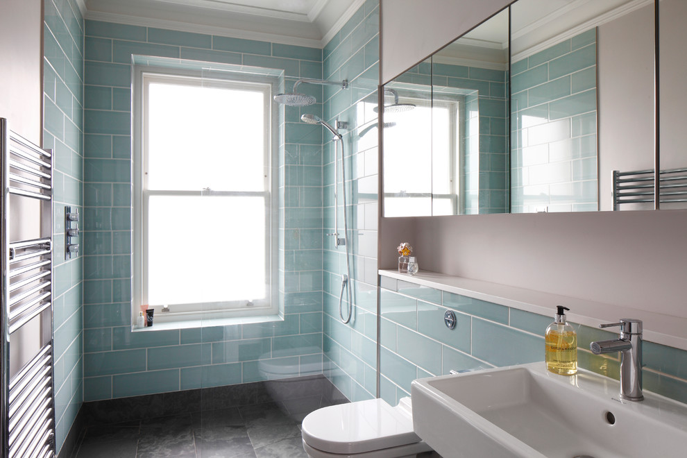 This is an example of a large classic grey and teal bathroom in London with a wall mounted toilet, an open shower, flat-panel cabinets, dark wood cabinets, a freestanding bath, grey tiles, stone slabs, grey walls, slate flooring, a console sink, quartz worktops, grey floors, white worktops, an enclosed toilet, double sinks, a built in vanity unit and a coffered ceiling.
