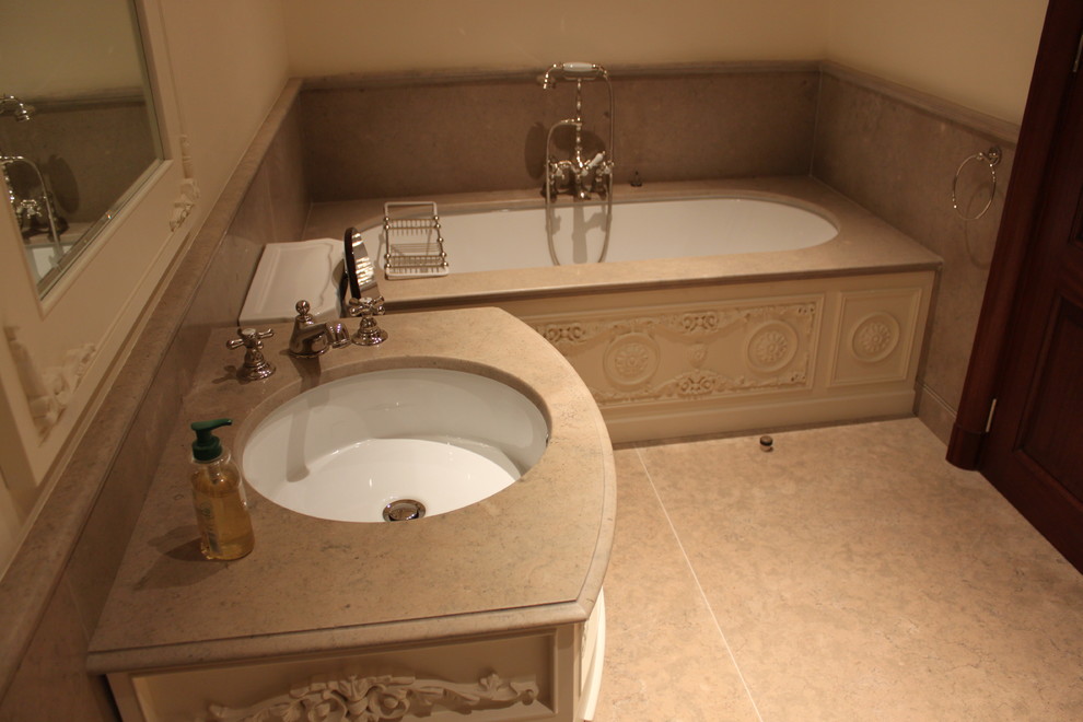 This is an example of a medium sized mediterranean ensuite bathroom in Nice with grey tiles, limestone tiles, grey walls, limestone flooring, limestone worktops and grey floors.
