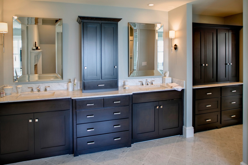 Coastal ensuite bathroom in Grand Rapids with a built-in sink, recessed-panel cabinets, dark wood cabinets, granite worktops, a corner shower, a bidet, grey walls and porcelain flooring.