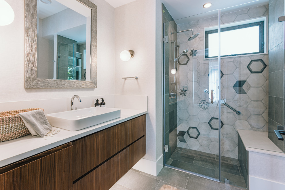 Small modern shower room bathroom in Vancouver with raised-panel cabinets, dark wood cabinets, a one-piece toilet, ceramic tiles, white walls, porcelain flooring, a vessel sink, granite worktops, beige floors, a hinged door and white worktops.