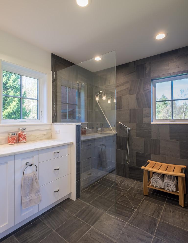 Photo of a medium sized country shower room bathroom in Boston with shaker cabinets, white cabinets, a walk-in shower, grey tiles, porcelain tiles, white walls, porcelain flooring, a submerged sink, marble worktops, grey floors and an open shower.