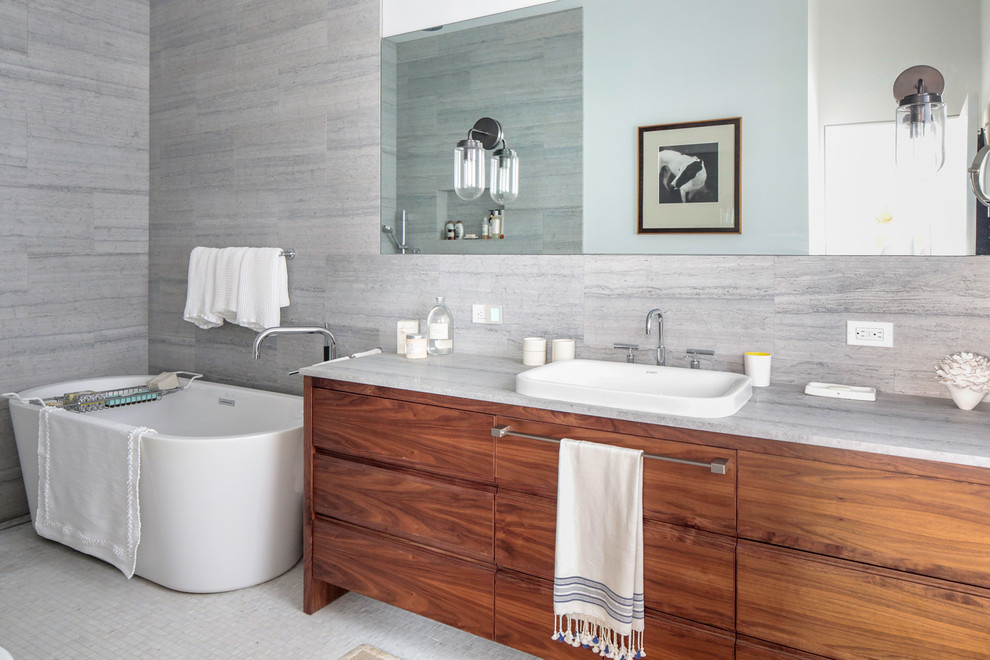Bathroom - mid-sized contemporary master white tile and mosaic tile bathroom idea in New York with flat-panel cabinets, white cabinets, a one-piece toilet, gray walls, an undermount sink, marble countertops, a hinged shower door and white countertops