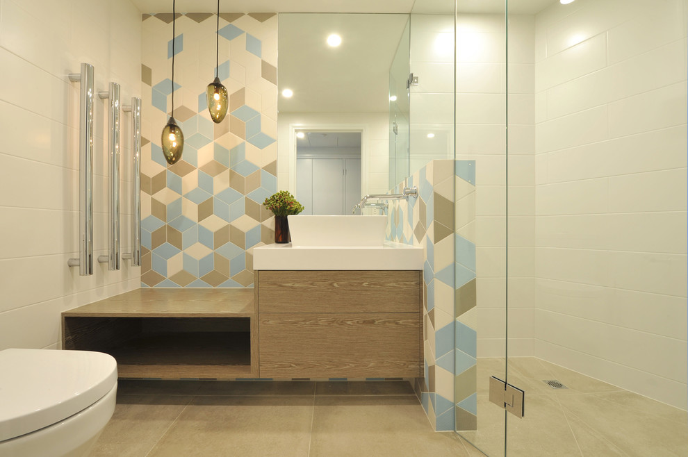 Medium sized contemporary bathroom in Melbourne with flat-panel cabinets, medium wood cabinets, a walk-in shower, a one-piece toilet, multi-coloured tiles, porcelain tiles, white walls, porcelain flooring, a vessel sink and engineered stone worktops.