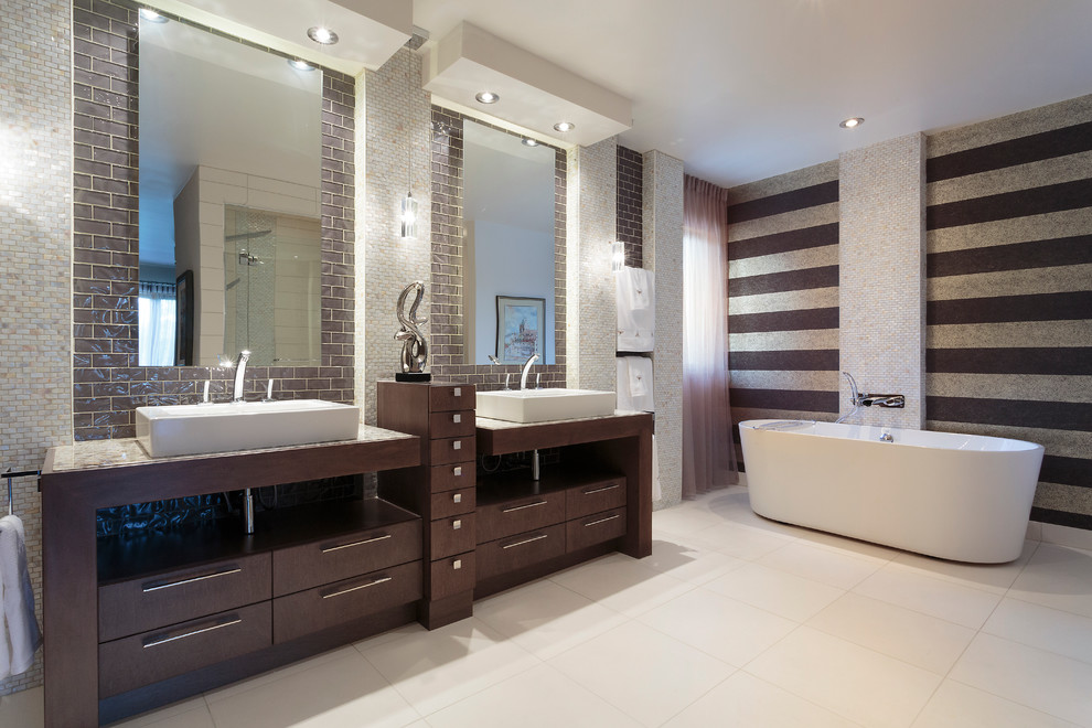 Large trendy master beige tile and mosaic tile beige floor bathroom photo in Other with flat-panel cabinets, dark wood cabinets, a two-piece toilet, a vessel sink and marble countertops
