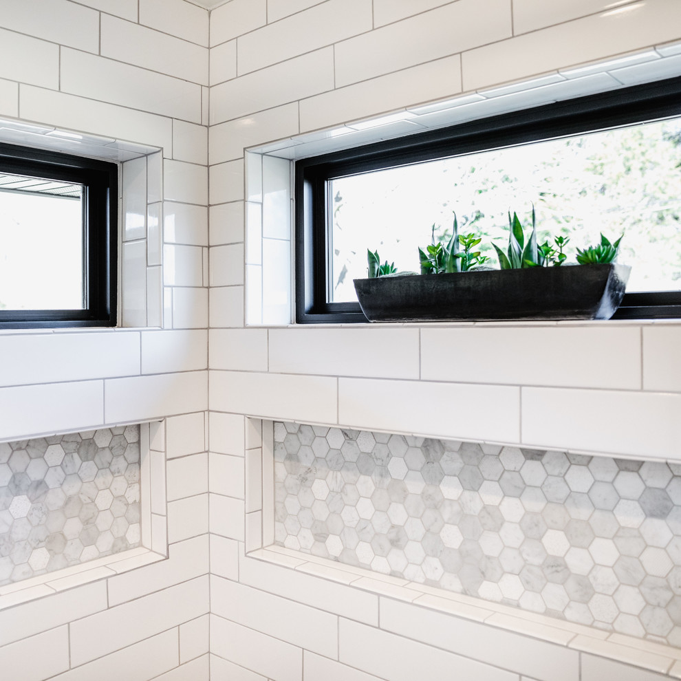 Inspiration for a mid-sized contemporary master white tile and subway tile ceramic tile and gray floor bathroom remodel in Other with flat-panel cabinets, dark wood cabinets, a one-piece toilet, gray walls, an undermount sink, quartz countertops, a hinged shower door and white countertops