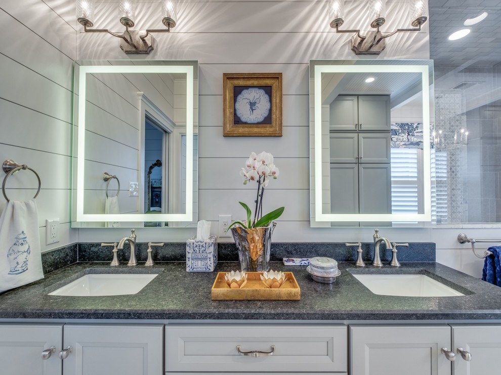 This is an example of an expansive traditional ensuite bathroom in Houston with shaker cabinets, grey cabinets, an alcove shower, a two-piece toilet, white tiles, mosaic tiles, white walls, porcelain flooring, a submerged sink, granite worktops, white floors, a hinged door and black worktops.
