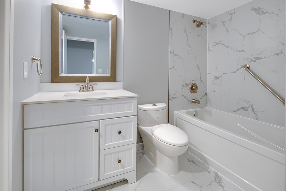 Design ideas for a medium sized scandinavian ensuite bathroom in Vancouver with freestanding cabinets, white cabinets, a built-in bath, a shower/bath combination, a one-piece toilet, white tiles, ceramic tiles, grey walls, ceramic flooring, a submerged sink, quartz worktops, white floors, an open shower and white worktops.