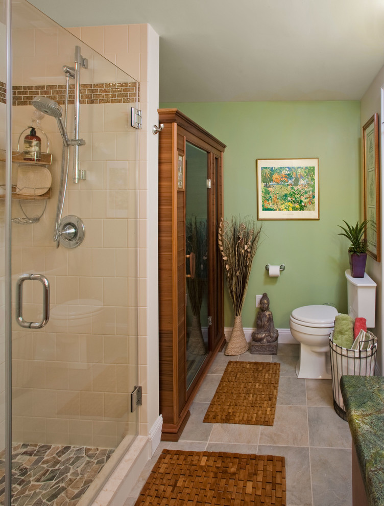 This is an example of a medium sized bohemian sauna bathroom in Philadelphia with flat-panel cabinets, medium wood cabinets, a walk-in shower, a two-piece toilet, beige tiles, ceramic tiles, green walls, porcelain flooring, a submerged sink, marble worktops, multi-coloured floors and a hinged door.