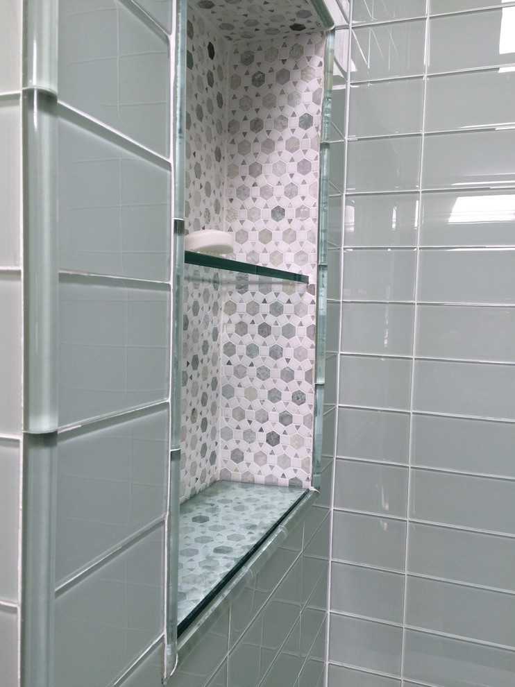 This is an example of a small traditional ensuite bathroom in Toronto with a submerged sink, an alcove bath, a shower/bath combination, green walls, mosaic tile flooring, freestanding cabinets, white cabinets, a one-piece toilet, green tiles, glass tiles and granite worktops.