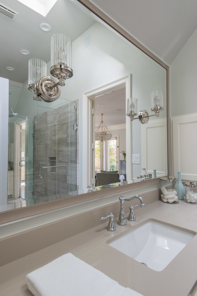 Photo of a large classic ensuite bathroom in Dallas with a built-in sink, shaker cabinets, white cabinets, engineered stone worktops, a freestanding bath, a walk-in shower, a one-piece toilet, beige tiles, stone tiles, green walls and travertine flooring.