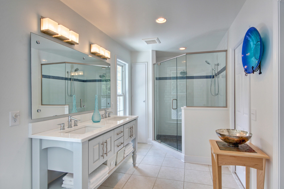 This is an example of a contemporary bathroom in Miami with open cabinets, a corner shower and white tiles.