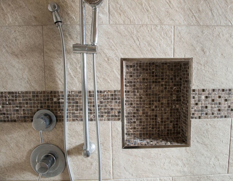 Photo of an expansive traditional ensuite bathroom in Other with shaker cabinets, medium wood cabinets, a freestanding bath, a corner shower, beige tiles, stone tiles, beige walls, a vessel sink, granite worktops, a two-piece toilet, pebble tile flooring, multi-coloured floors and an open shower.