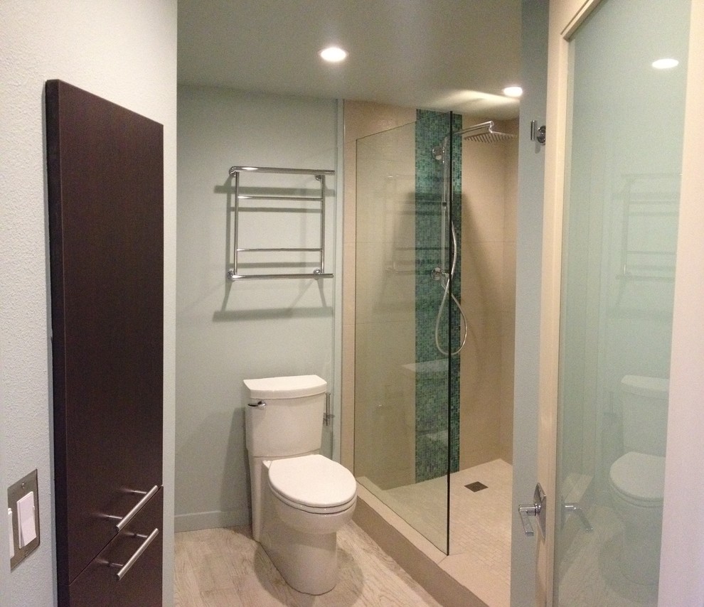 Doorless shower - mid-sized transitional master beige tile and porcelain tile porcelain tile doorless shower idea in Hawaii with an integrated sink, flat-panel cabinets, dark wood cabinets, solid surface countertops, a two-piece toilet and blue walls