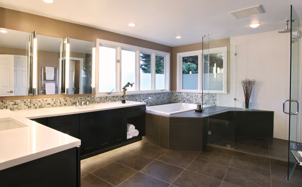 Inspiration for a large contemporary master glass tile, black and white tile and multicolored tile porcelain tile bathroom remodel in Seattle with flat-panel cabinets, dark wood cabinets, a one-piece toilet, an undermount sink, quartz countertops and beige walls