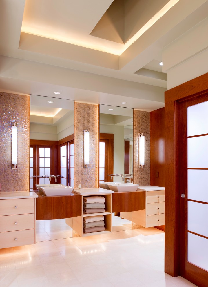 Bathroom - mid-sized contemporary master multicolored tile and mosaic tile bathroom idea in Other with a vessel sink, flat-panel cabinets, light wood cabinets and beige walls