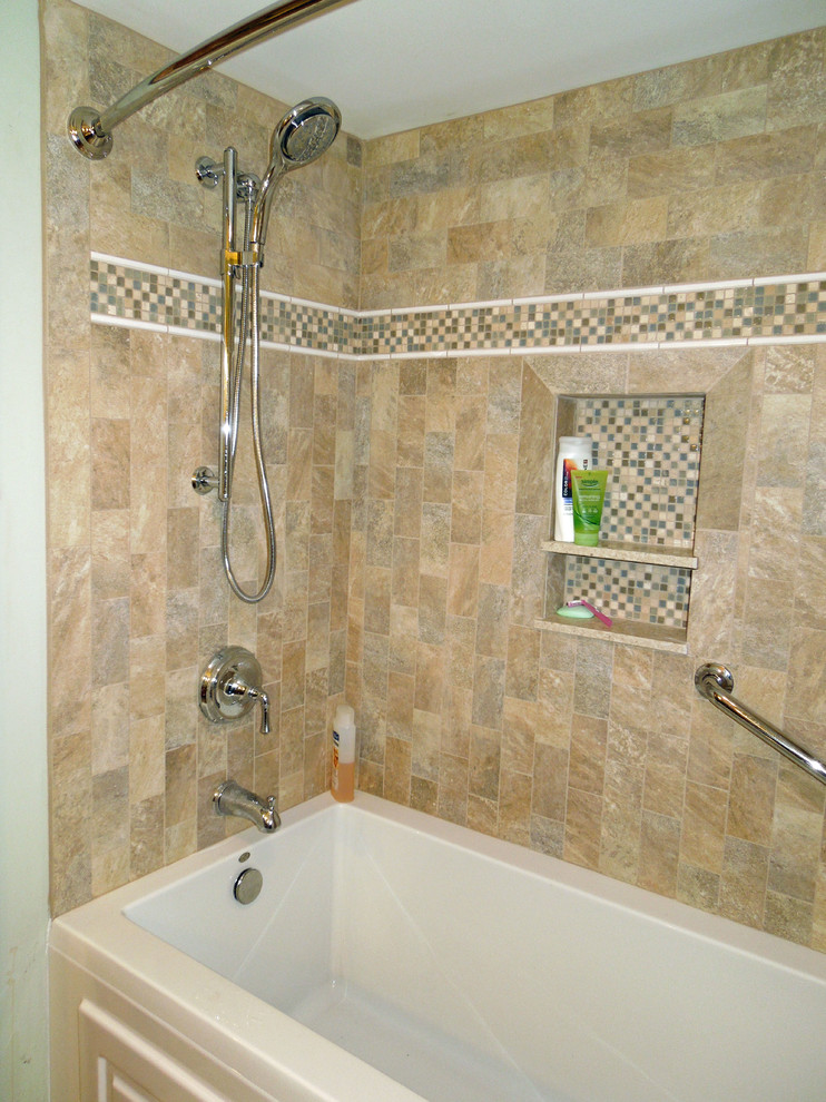 Photo of a medium sized traditional bathroom in Charleston with a submerged sink, freestanding cabinets, medium wood cabinets, granite worktops, an alcove bath, a shower/bath combination, a two-piece toilet, beige tiles, porcelain tiles, green walls and porcelain flooring.