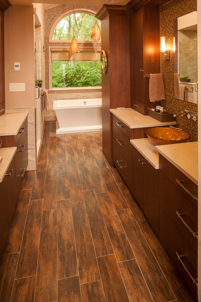 Bathroom - huge asian master brown tile and porcelain tile porcelain tile and brown floor bathroom idea in New York with flat-panel cabinets, medium tone wood cabinets, a two-piece toilet, brown walls, a vessel sink, quartz countertops and a hinged shower door