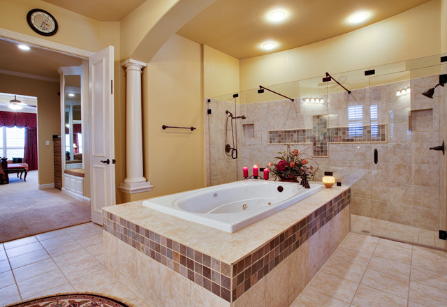 Design ideas for a classic bathroom in Dallas with a built-in bath, a double shower, beige tiles and stone tiles.