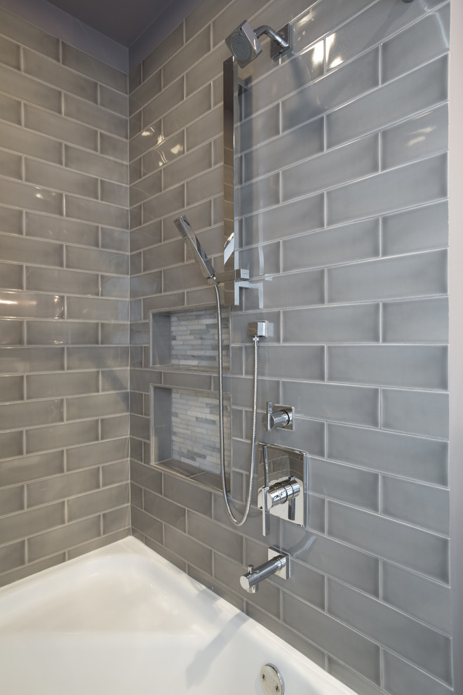 Example of a mid-sized transitional master gray tile and ceramic tile porcelain tile bathroom design in Chicago with flat-panel cabinets, medium tone wood cabinets, a two-piece toilet, gray walls, an undermount sink and quartz countertops