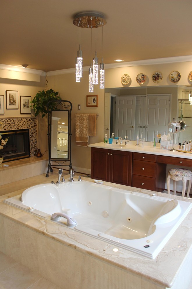 Photo of an expansive classic ensuite bathroom in Baltimore with a submerged sink, recessed-panel cabinets, medium wood cabinets, a freestanding bath, a one-piece toilet, beige tiles, ceramic tiles, beige walls and ceramic flooring.