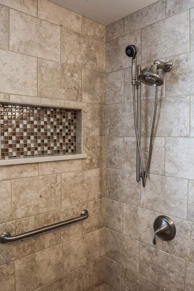 Mid-sized transitional master beige tile and glass tile porcelain tile corner shower photo in Other with an undermount sink, raised-panel cabinets, medium tone wood cabinets, quartz countertops, a two-piece toilet and beige walls