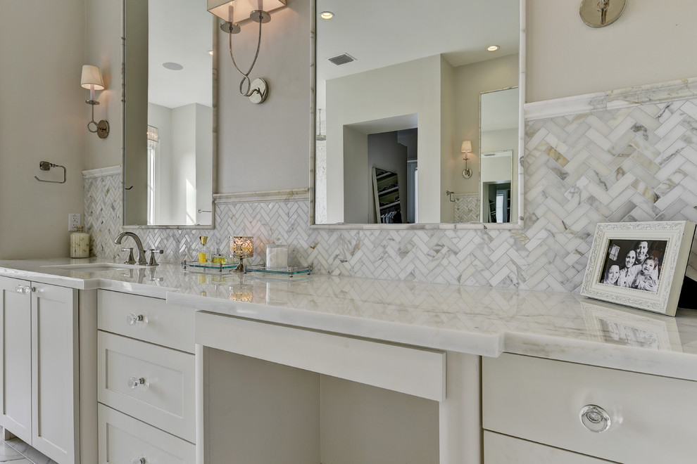 Bathroom - huge transitional master gray tile, white tile and stone tile marble floor and gray floor bathroom idea in Austin with shaker cabinets, white cabinets, beige walls, an undermount sink, marble countertops and a hinged shower door
