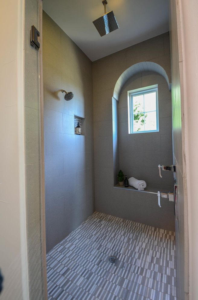 Large tuscan master gray tile and porcelain tile porcelain tile and gray floor drop-in bathtub photo in Austin with shaker cabinets, white cabinets, a two-piece toilet, white walls, an undermount sink, marble countertops and a hinged shower door