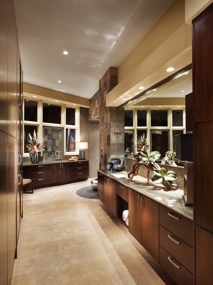 На фото: ванная комната в современном стиле с врезной раковиной, плоскими фасадами, темными деревянными фасадами, бежевой плиткой и плиткой из сланца с