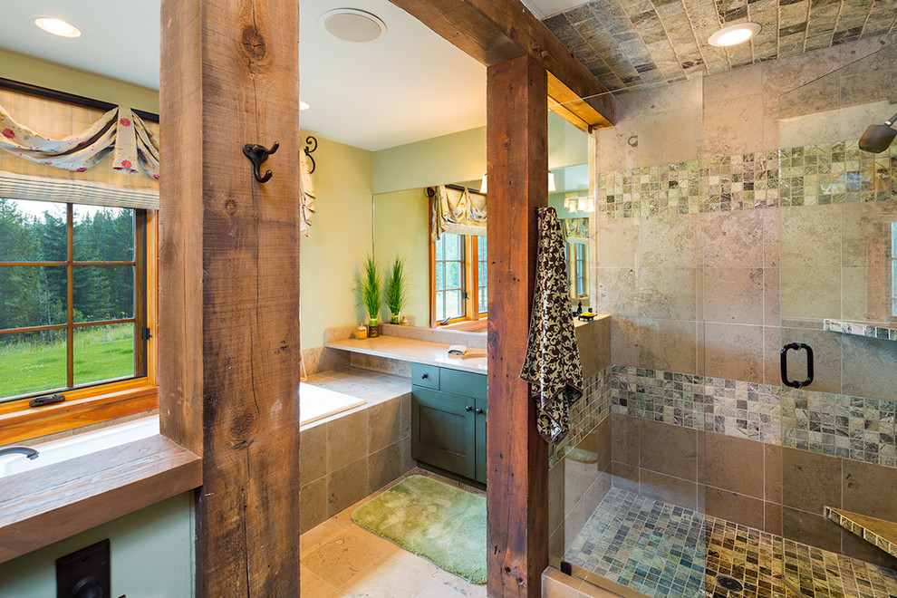 Inspiration for a large traditional ensuite bathroom in Other with recessed-panel cabinets, green cabinets, soapstone worktops, a submerged bath, an alcove shower, beige tiles and slate flooring.