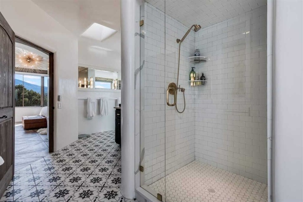 Double shower - large transitional white tile and marble tile porcelain tile and multicolored floor double shower idea in Albuquerque with shaker cabinets, an undermount tub, a one-piece toilet, white walls, an undermount sink, quartz countertops, a hinged shower door and white countertops