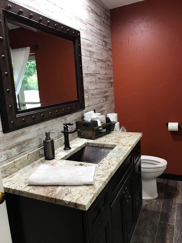 Mid-sized tuscan master white tile and subway tile bathroom photo in Cedar Rapids with flat-panel cabinets, dark wood cabinets, a two-piece toilet, orange walls, an undermount sink, quartz countertops and beige countertops