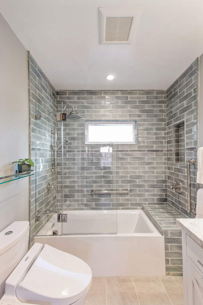 Example of a small transitional master blue tile and ceramic tile ceramic tile and beige floor bathroom design in San Francisco with recessed-panel cabinets, white cabinets, a two-piece toilet, gray walls, an undermount sink, marble countertops and white countertops