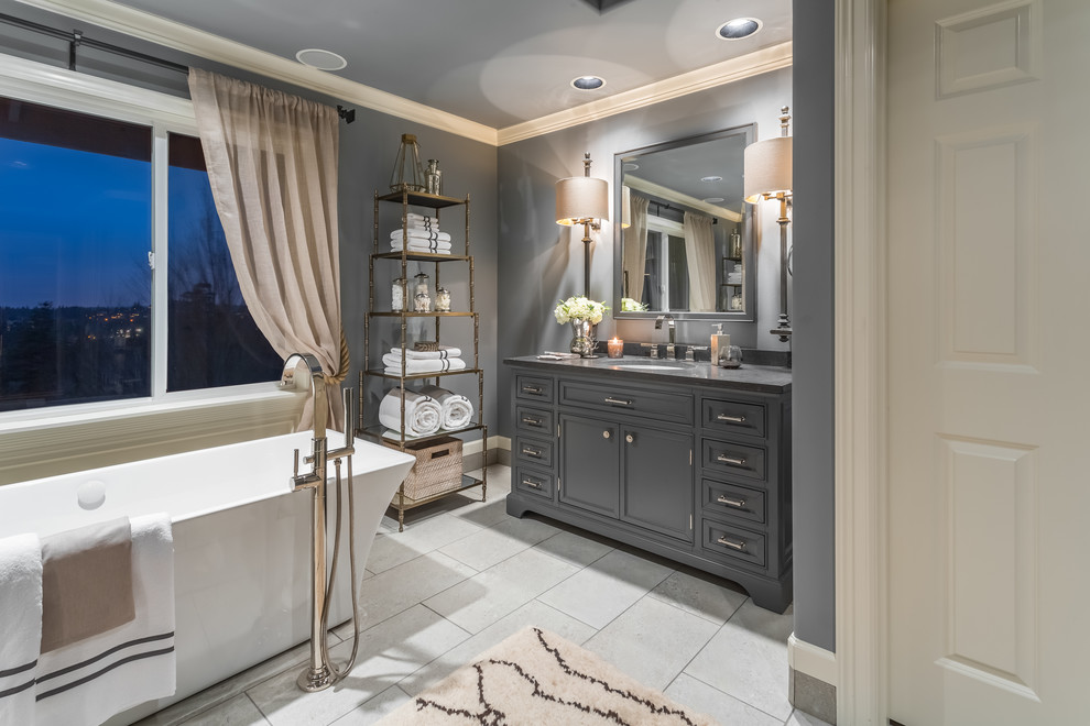 Bathroom - large transitional master porcelain tile and gray floor bathroom idea in Seattle with furniture-like cabinets, gray cabinets, gray walls, an undermount sink and a hinged shower door
