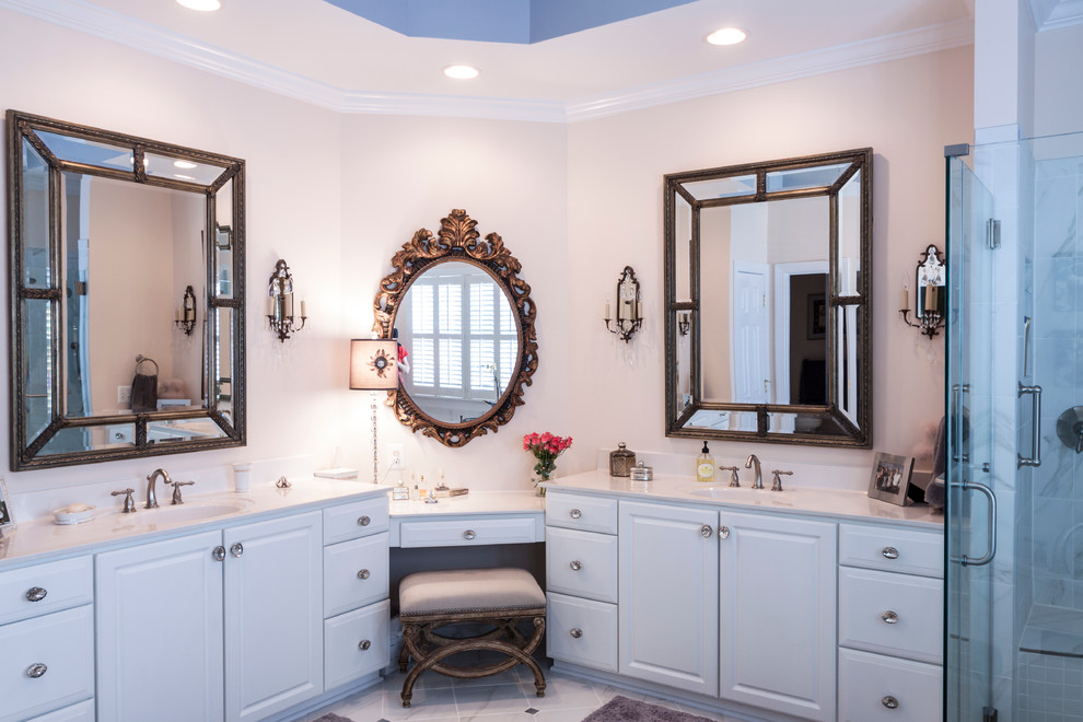 Example of an eclectic gray tile and ceramic tile marble floor bathroom design in DC Metro with an integrated sink, raised-panel cabinets, white cabinets, marble countertops and a two-piece toilet