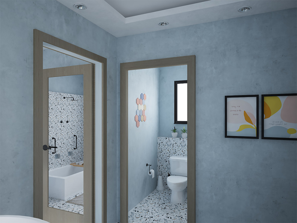 Idee per una grande stanza da bagno minimalista con vasca sottopiano, vasca/doccia, WC a due pezzi, piastrelle blu, pareti blu, pavimento alla veneziana, pavimento multicolore, doccia aperta e toilette