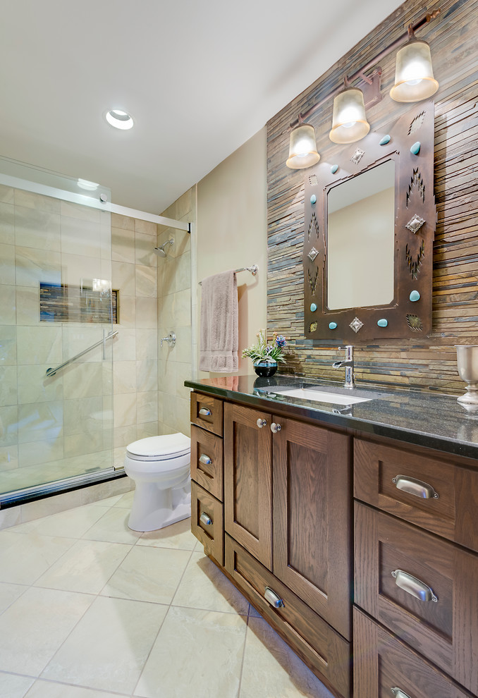 Alcove shower - large southwestern 3/4 beige tile travertine floor alcove shower idea in Chicago with recessed-panel cabinets, dark wood cabinets, beige walls, an undermount sink and quartz countertops