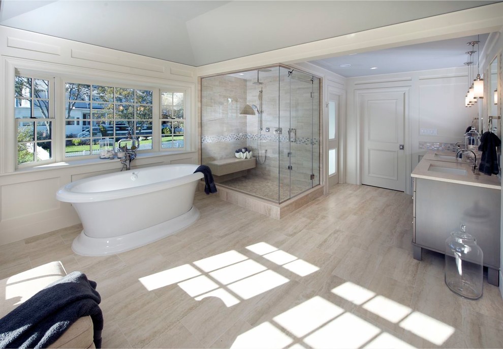 Example of a large trendy master beige tile and porcelain tile porcelain tile and beige floor bathroom design in Boston with gray cabinets, white walls, an undermount sink, quartz countertops, a hinged shower door and recessed-panel cabinets