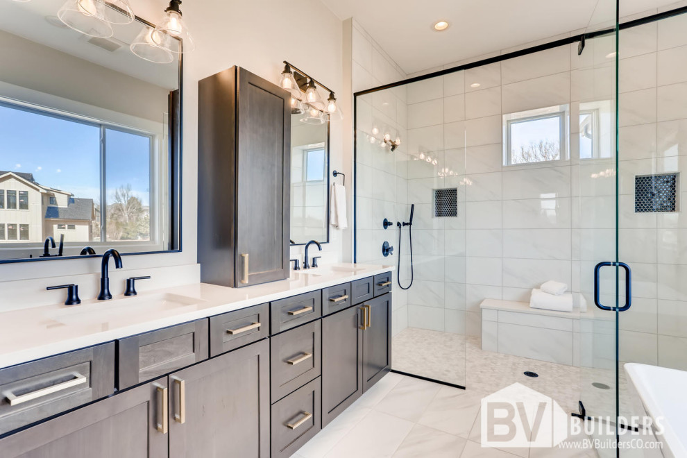 Bathroom - cottage white tile and porcelain tile porcelain tile, white floor and double-sink bathroom idea in Denver with shaker cabinets, gray cabinets, gray walls, an undermount sink, quartz countertops, a hinged shower door, white countertops, a niche and a built-in vanity