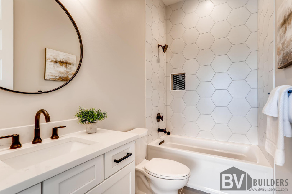 Inspiration for a cottage white tile and porcelain tile porcelain tile, gray floor and single-sink bathroom remodel in Denver with shaker cabinets, white cabinets, a two-piece toilet, gray walls, an undermount sink, quartz countertops, white countertops, a niche and a built-in vanity