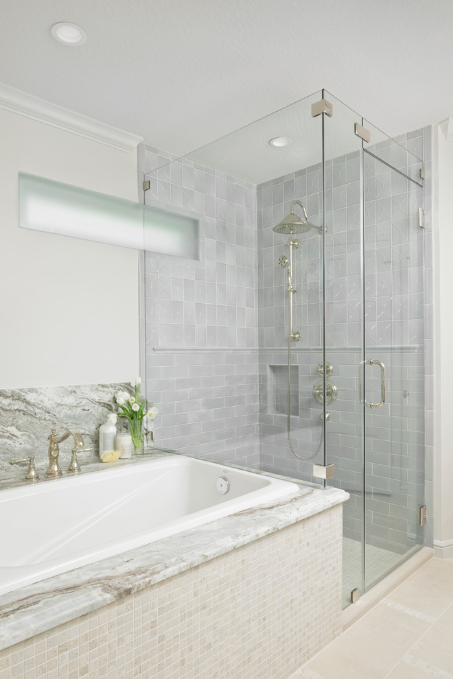 Traditional bathroom in Houston with grey tiles.