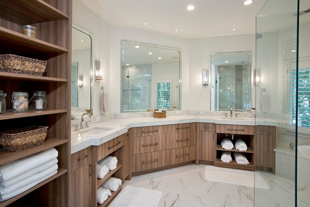Design ideas for a large contemporary ensuite bathroom in Charleston with flat-panel cabinets, medium wood cabinets, a corner shower, white tiles, marble tiles, white walls, marble flooring, a submerged sink, quartz worktops, white floors, a hinged door and white worktops.