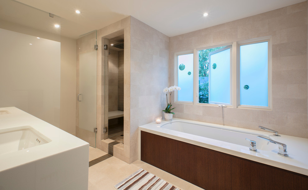Inspiration for a medium sized contemporary ensuite bathroom in DC Metro with flat-panel cabinets, dark wood cabinets, a built-in bath, a one-piece toilet, a submerged sink, quartz worktops, porcelain tiles, a corner shower, beige tiles, white walls and porcelain flooring.