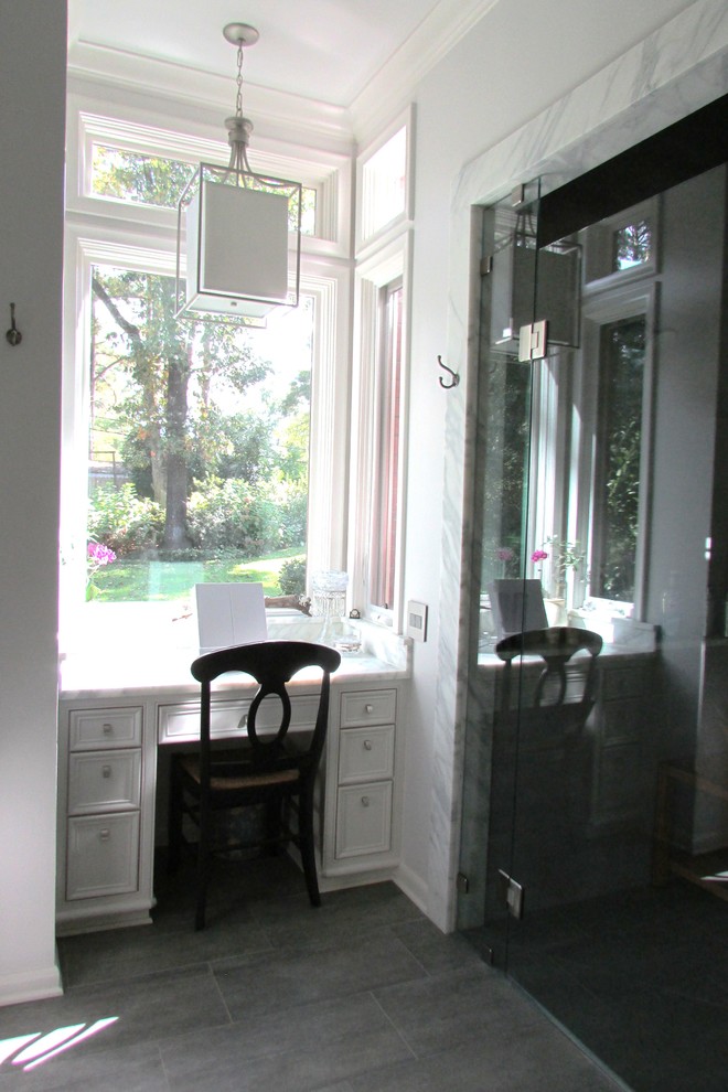 Photo of a large contemporary ensuite bathroom in New Orleans with recessed-panel cabinets, white cabinets, a submerged bath, an alcove shower, a two-piece toilet, white walls, dark hardwood flooring, a submerged sink and marble worktops.
