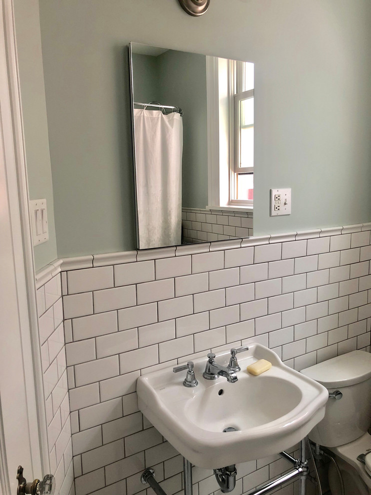 Design ideas for a medium sized classic ensuite bathroom in Philadelphia with open cabinets, white cabinets, a freestanding bath, a shower/bath combination, a two-piece toilet, multi-coloured tiles, ceramic tiles, grey walls, a console sink, ceramic flooring and white floors.