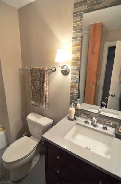 Photo of a medium sized traditional shower room bathroom in Chicago with a submerged sink, flat-panel cabinets, dark wood cabinets, engineered stone worktops, a two-piece toilet, multi-coloured tiles, mosaic tiles, beige walls and porcelain flooring.