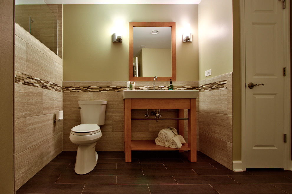 Photo of a large contemporary ensuite bathroom in Chicago with open cabinets, light wood cabinets, an alcove shower, a two-piece toilet, beige tiles, brown tiles, white tiles, beige walls and an integrated sink.