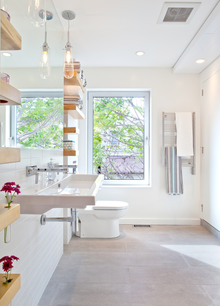 Modern bathroom in Toronto with a trough sink.