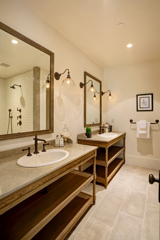 Bathroom - mid-sized farmhouse 3/4 beige tile and stone slab ceramic tile bathroom idea in San Francisco with marble countertops, flat-panel cabinets, medium tone wood cabinets, a one-piece toilet, beige walls and a drop-in sink