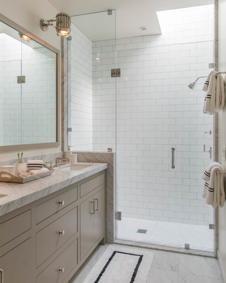 Inspiration for a mid-sized transitional 3/4 white tile and subway tile marble floor and white floor doorless shower remodel in San Francisco with beige cabinets, white walls, an undermount sink, marble countertops, flat-panel cabinets and a hinged shower door
