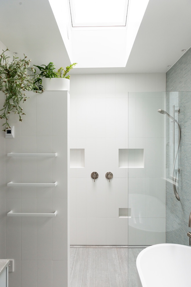Inspiration for a mid-sized contemporary master white tile and ceramic tile porcelain tile and gray floor bathroom remodel in Auckland with furniture-like cabinets, blue cabinets, a one-piece toilet, white walls, an undermount sink, quartz countertops and blue countertops